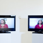 2 monitors in a gallery space