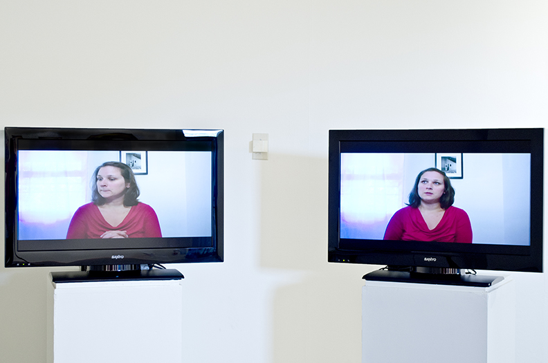 2 monitors in a gallery space