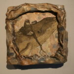 Etching of bird on stone