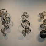 circular laser cut illustrations on a wall