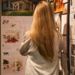 Back shot of girl looking at her project