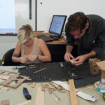 Front shot of two students working