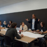 Angled shot of Chris Bruning talking to students