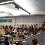 Angled shot of students listening to presentation