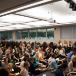 Angled shot of students listening to lecture