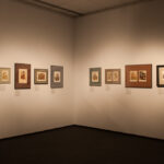 Angled shot of works along the wall