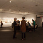 Angled shot of room with people