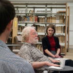 Back shot of graduate students listening to Jean Massing