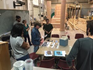 Zsolt and the entire class discussing Luke's model and composition during the design phase