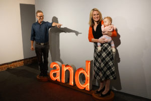 Kevin Curry and his family demonstrate his sculpture Conjunction at “The Faculty Annual.”