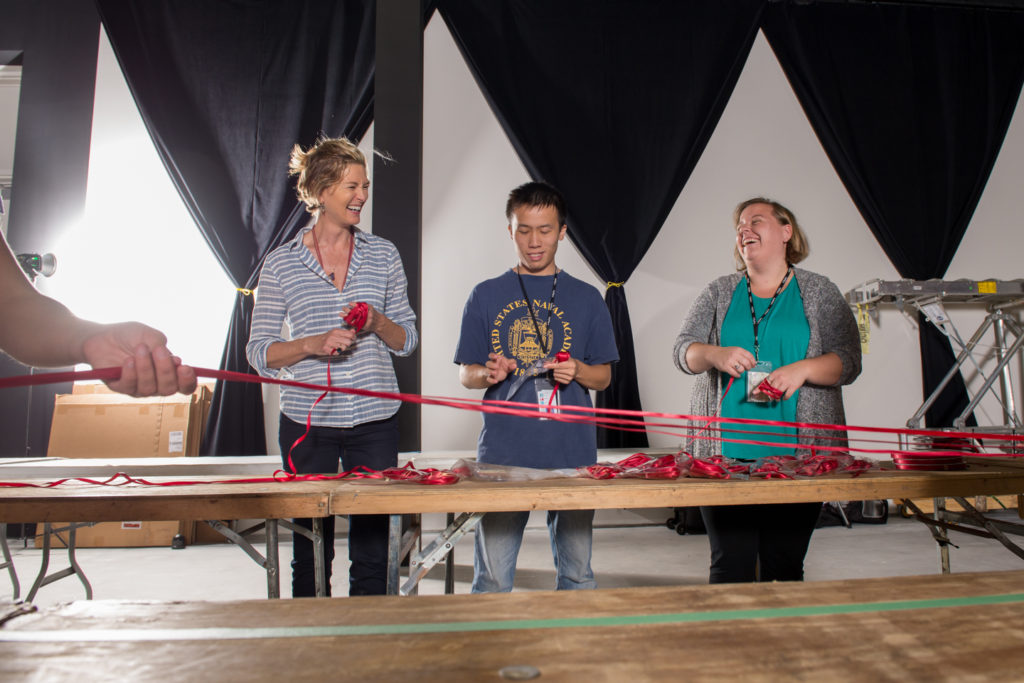Patterson worked with volunteers to cut more than 24 miles of satin ribbon for her installation. Photo courtesy of The Ringling.