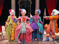 Actors in colorful costumes on a stage