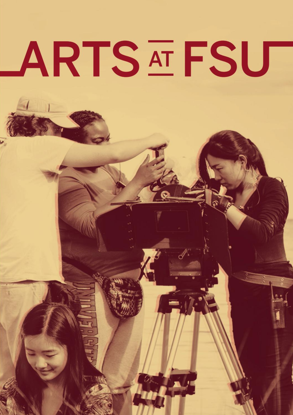 there is a black and white photo of a group of people working on a camera