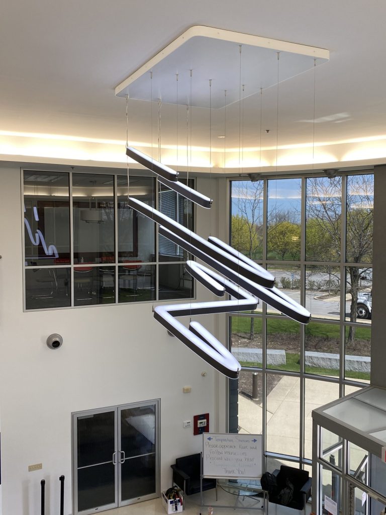 a view of the lobby of a building with large windows