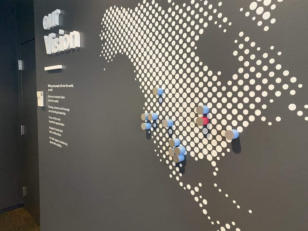 a map of the united states is displayed on a wall