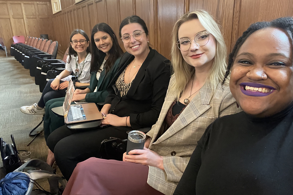 a group of women sitting together in an auditorium