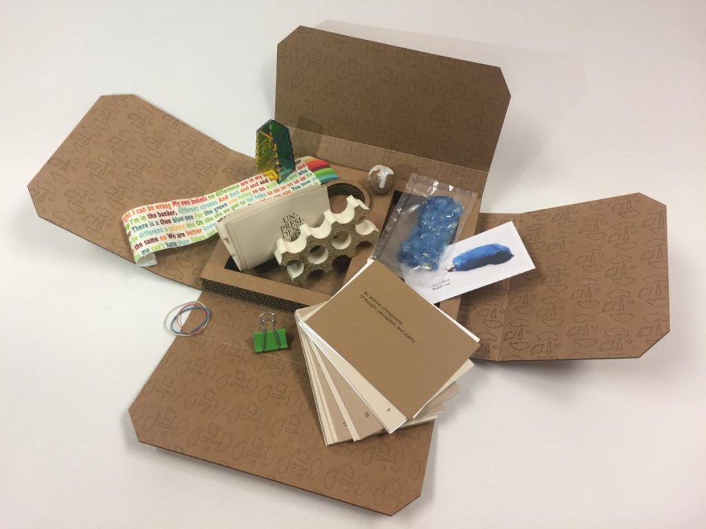 there is a cardboard box with a bunch of items inside of it