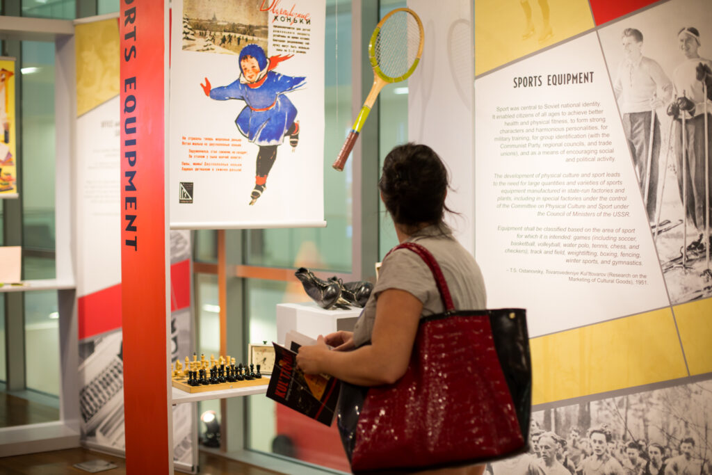 a woman holding a red purse
