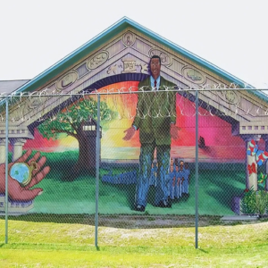 there is a large mural of a man on the side of a building