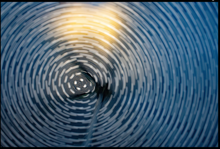 Artwork featuring a blur rippling pattern, reminiscent of water.