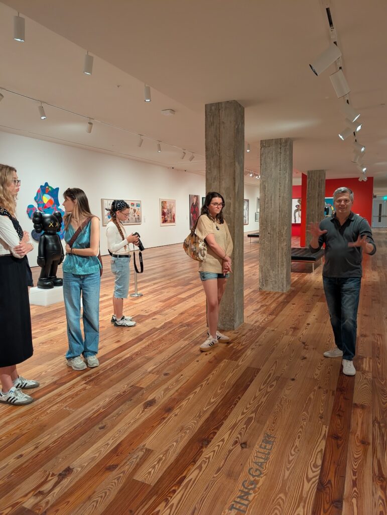 A group of people in a modern art gallery