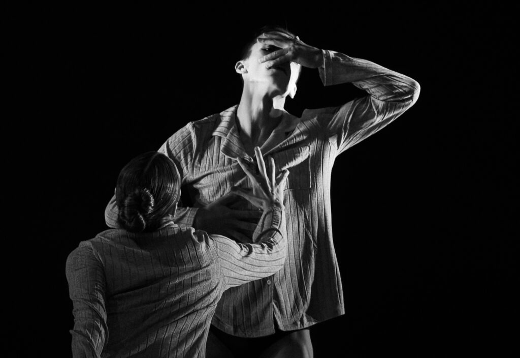 A black and white photo of dancers