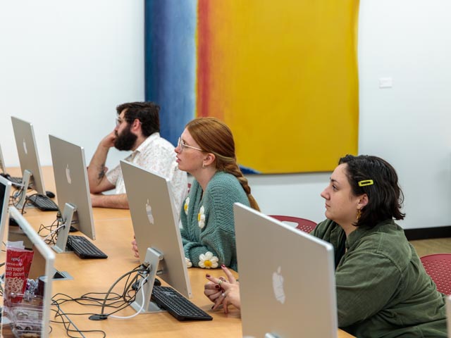 People sitting at a desktop