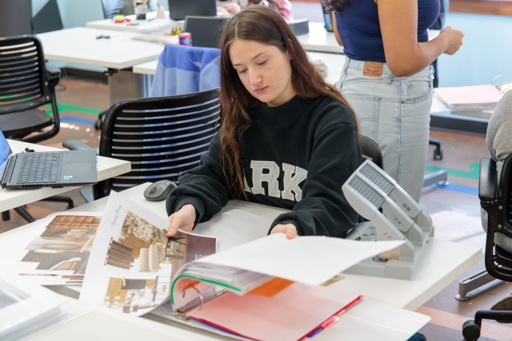 student looking through designs
