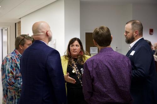 Brandi Markiewicz (BS 2002) engages in conversation at the reception. 